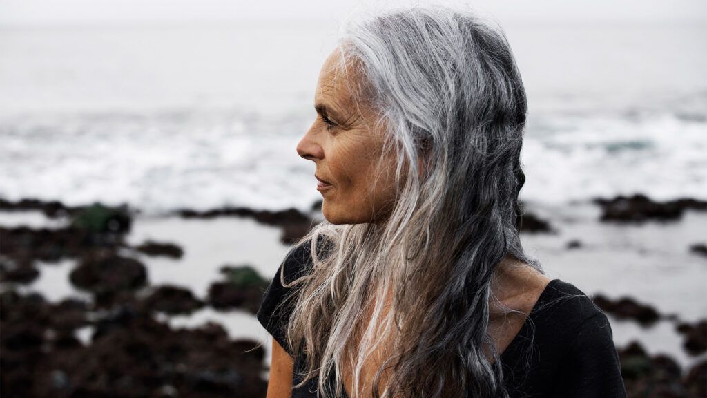 Older female by the ocean