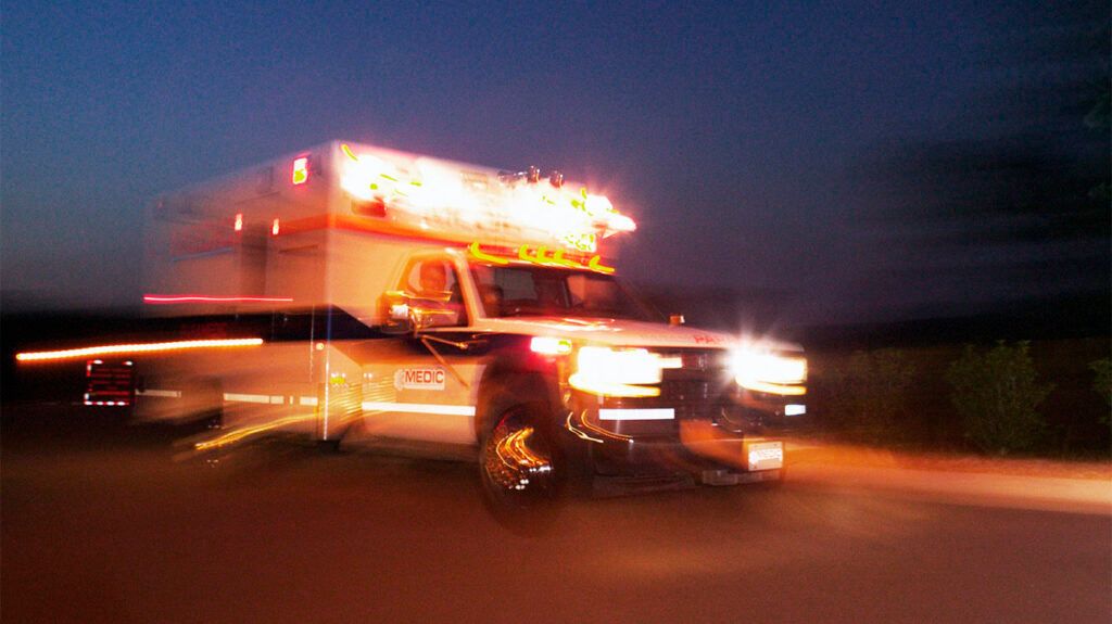 Motion blur of an ambulance on the road 1