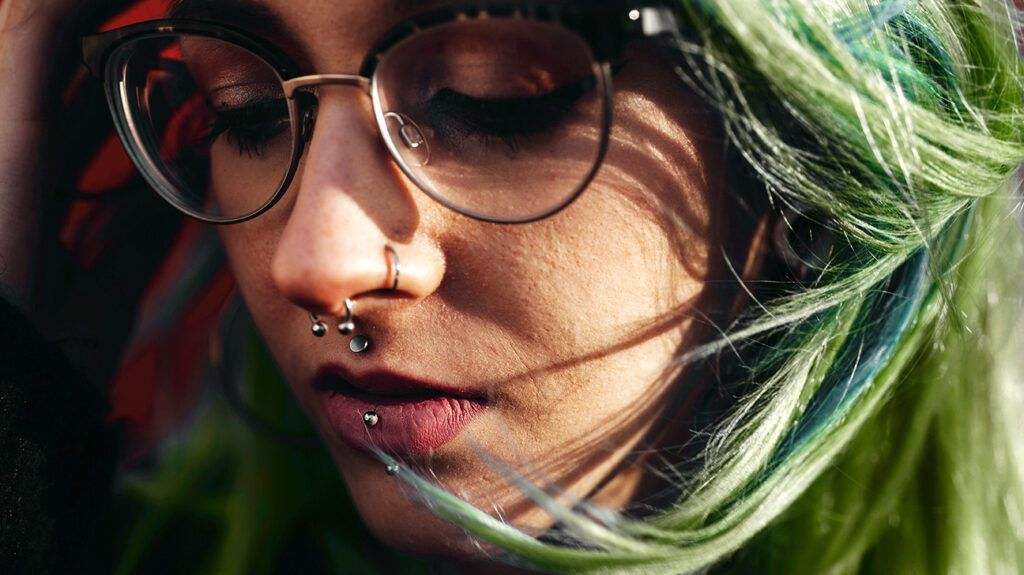 A person with a nose piercing bump.-1