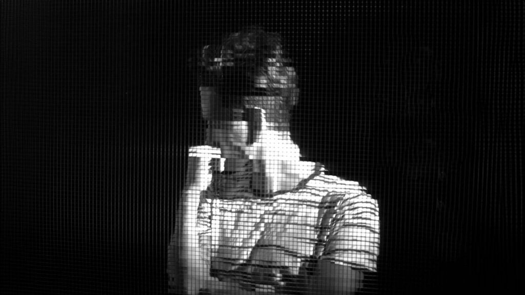 Black and white pixelated image of a person 