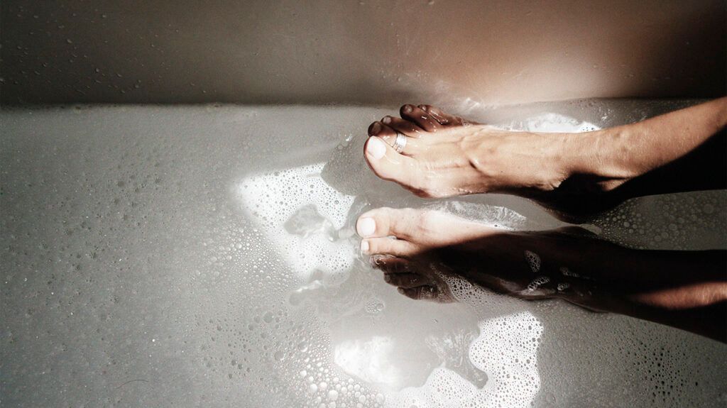 A person taking a bath which may increase the risk of developing a UTI -2.