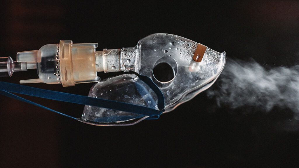A nebulizer mouthpiece and tube. -1