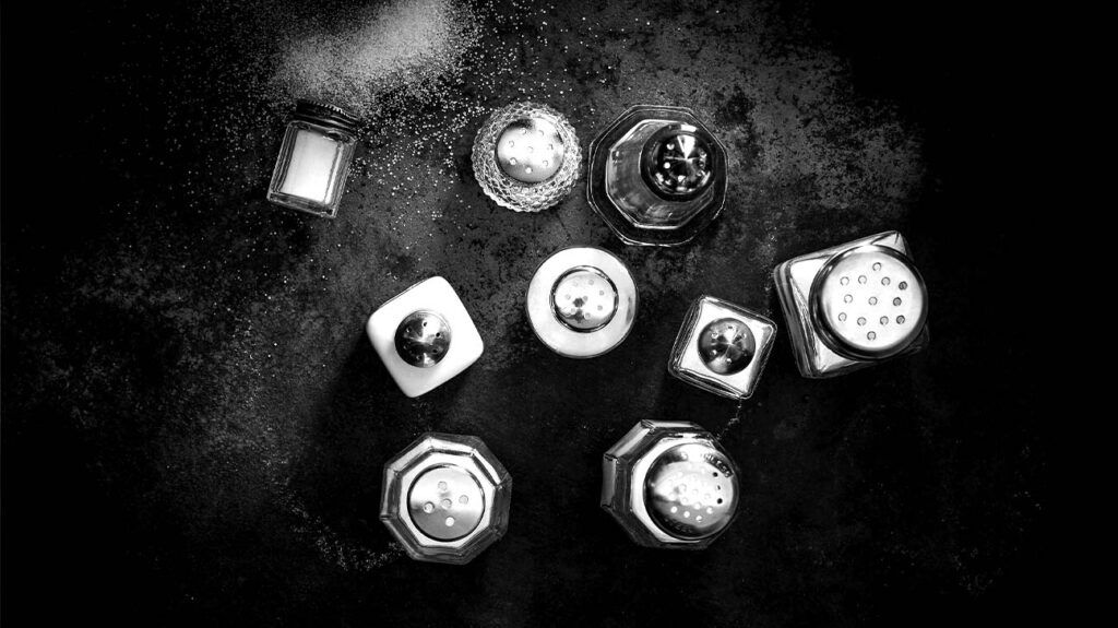 Black and white overhead view of salt shakers