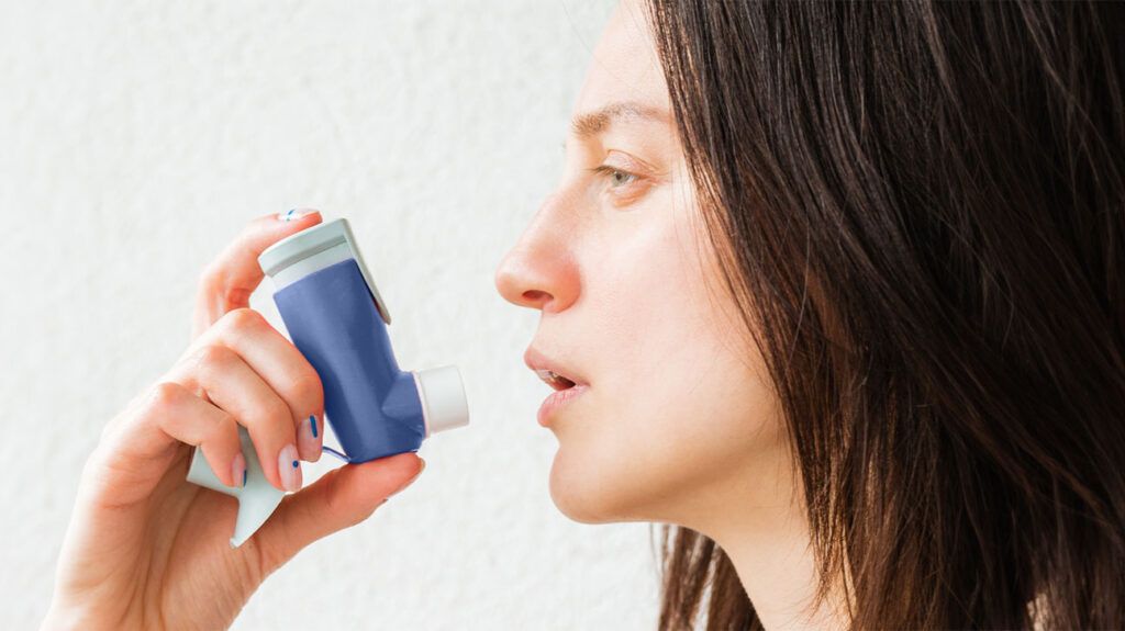 A person using an asthma inhaler-1.