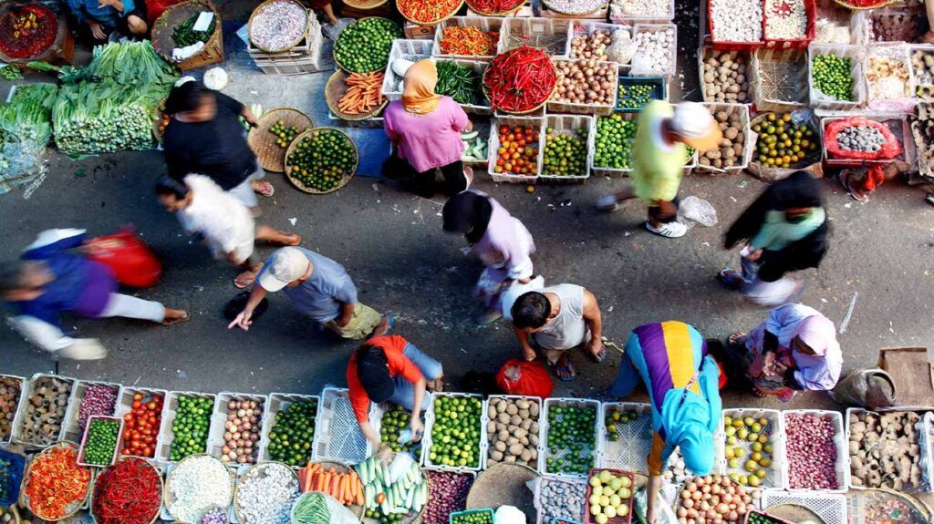 bird's eye view of people in fruit and vegetable market