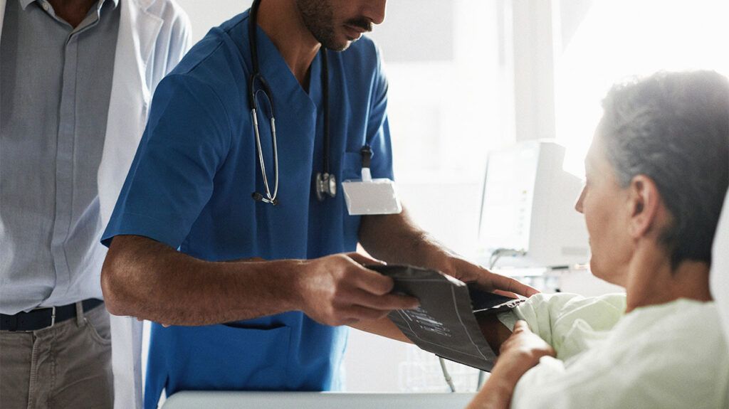 A doctor testing a woman for AFib with ECG aberrancy. -2