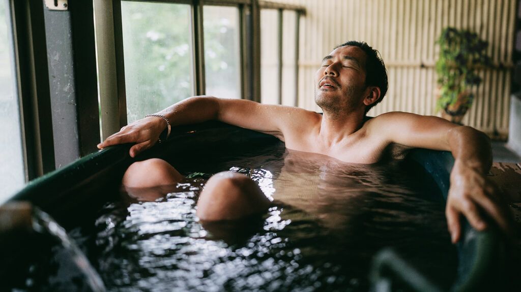 A person is relaxing in a bath.