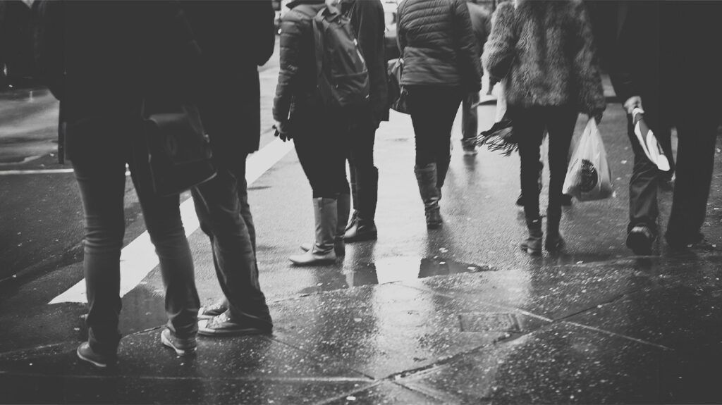 A crowd standing in the rain -1