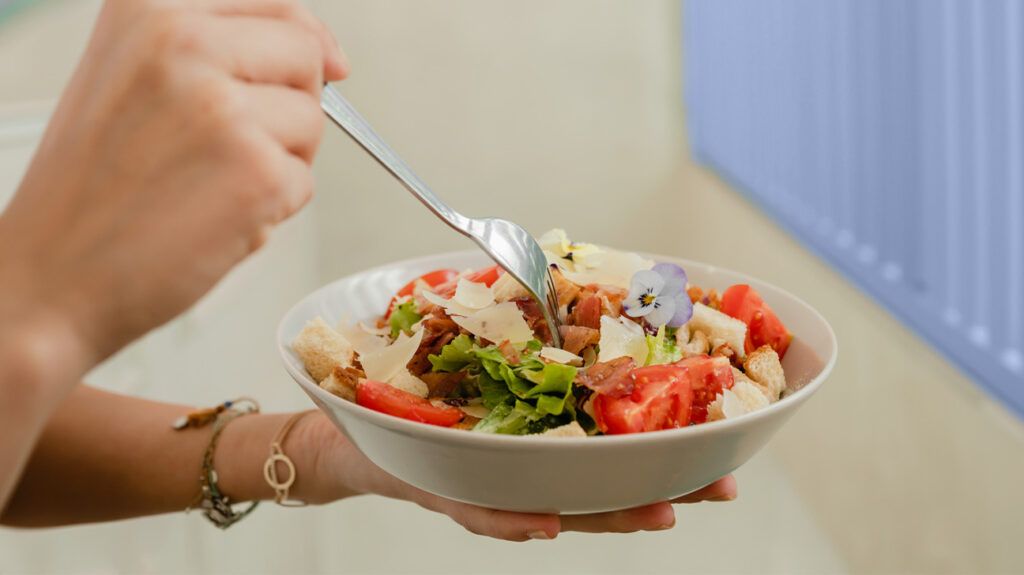 A bowl of food including tomatoes 1