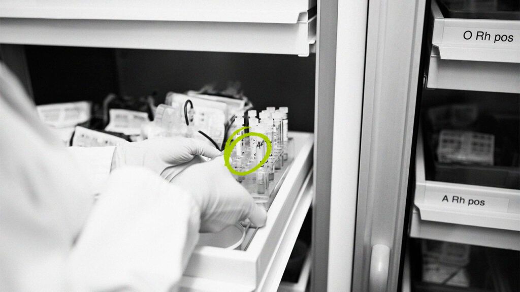 Gloved hands preparing treatments from a white drawer.-2