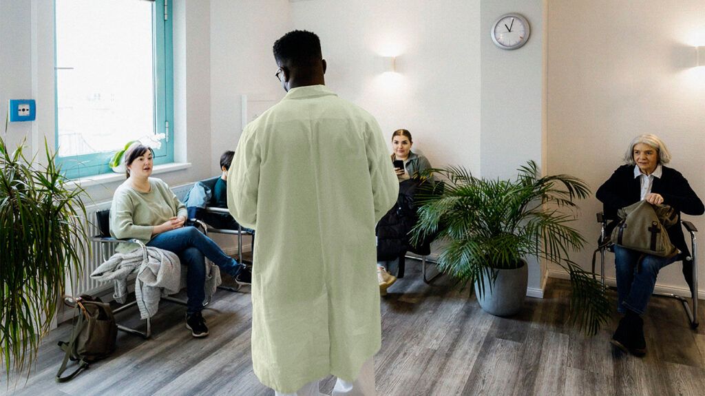 A doctor is talking to a person in a waiting room.