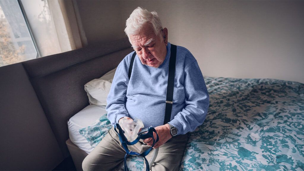 Older male with CPAP machine