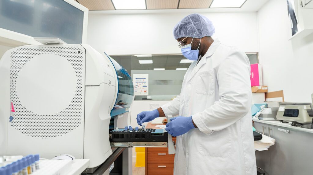 A lab technician analyzing blood samples to test for anemia.