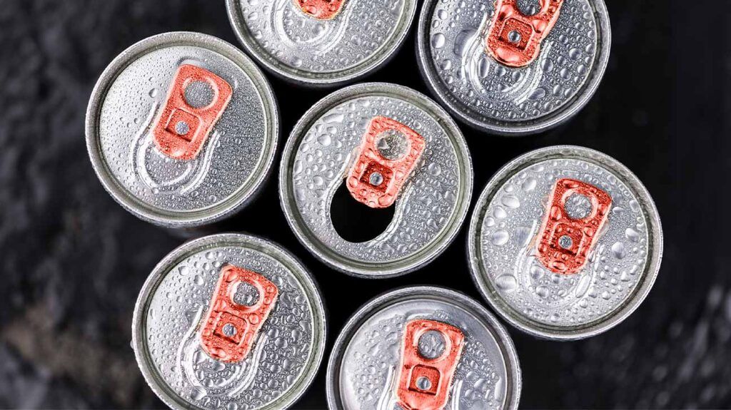 The tops of seven energy drink cans