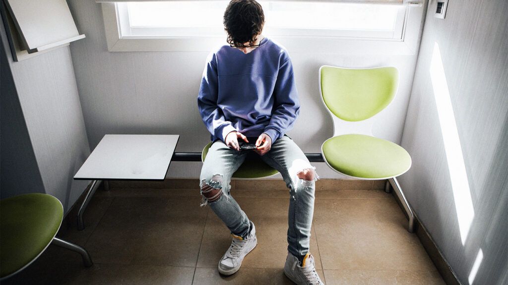 A child sitting in a waiting room 1