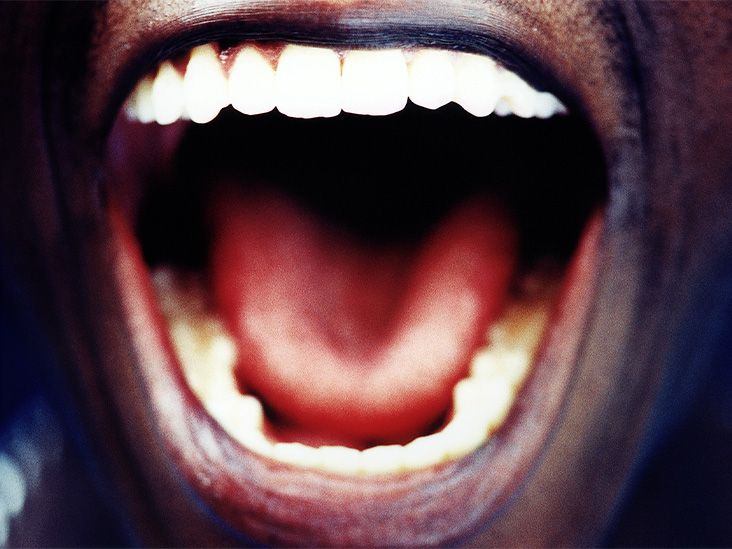 closeup of a person's open mouth