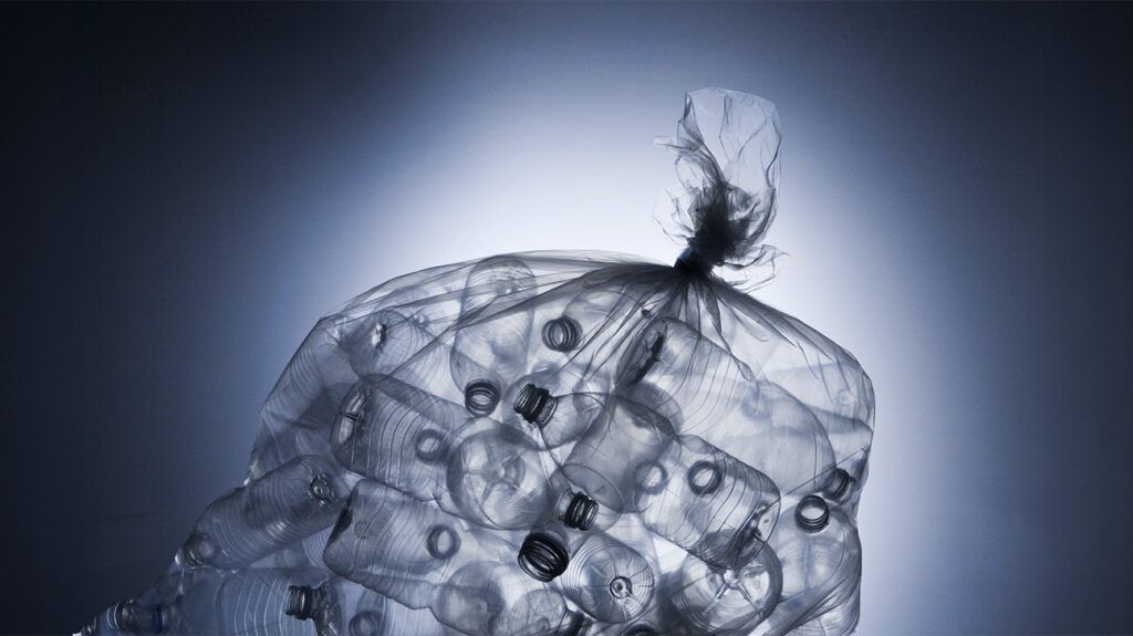 Xray view of garbage bag full of plastic bottles