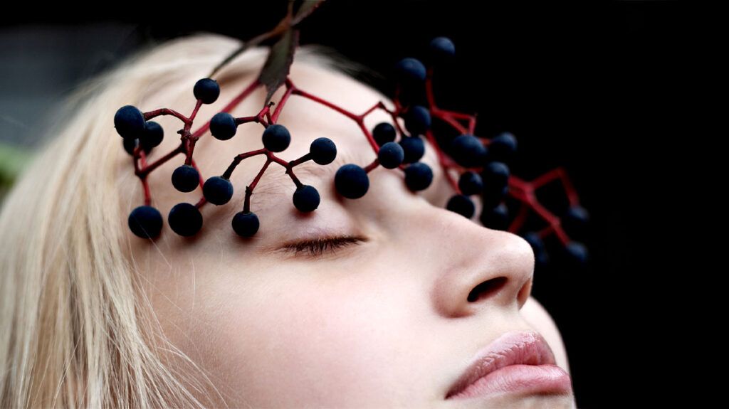 person with berries on their head