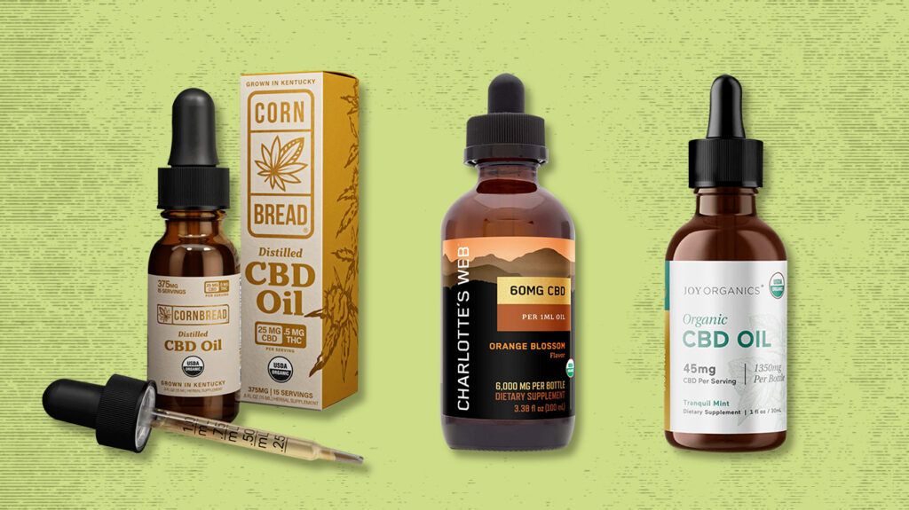 A selection of CBD oils against a green background, including oils from Charlotte's Web, Lazarus Naturals, Joy Organics, and Cornbread Hemp.