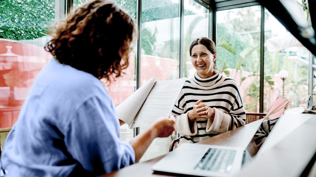 A healthcare professional talking to a person 1