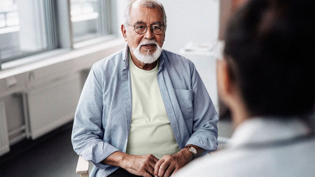 A person is talking with a medical professional.