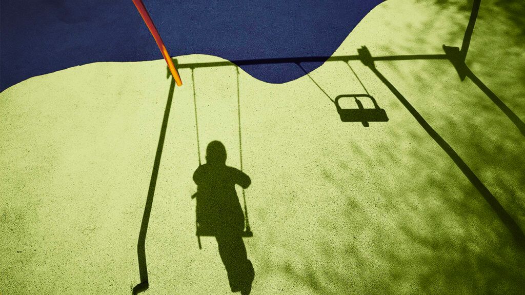 Shadow of a person on a swing.