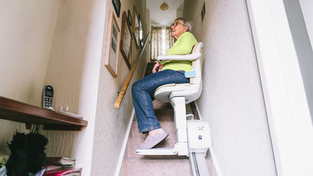 An older adult in a stair lift-1.