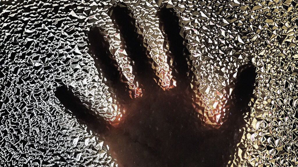 View of a hand through frosted glass 1