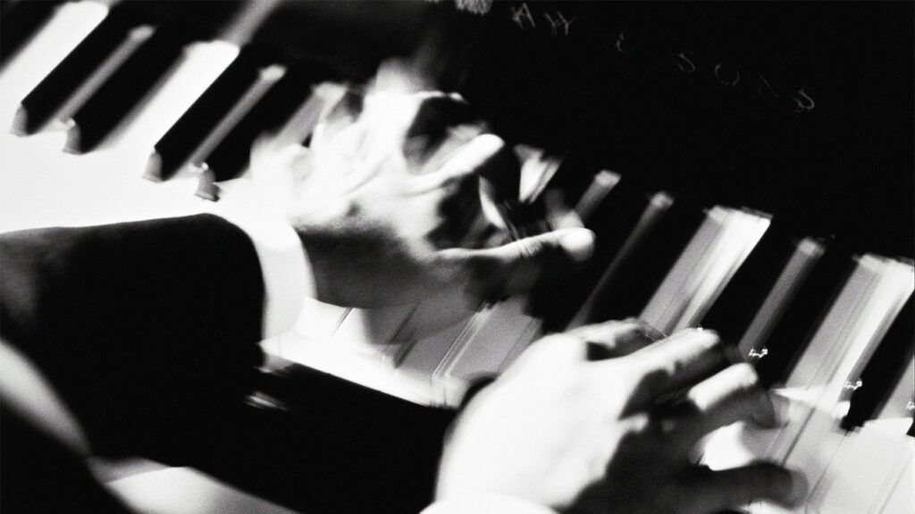 A close up of a person playing the piano 