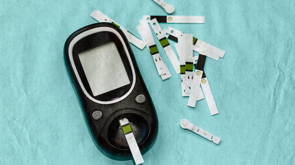 Image of a blood sugar monitor and strips