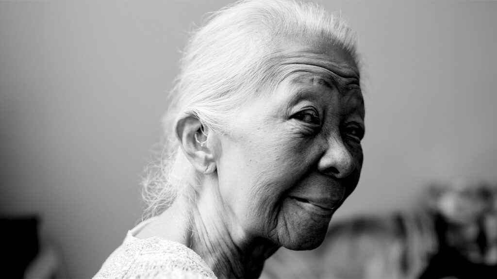 black and white portrait of an older East Asian woman