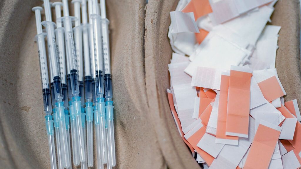 disposable vaccine syringes and plasters