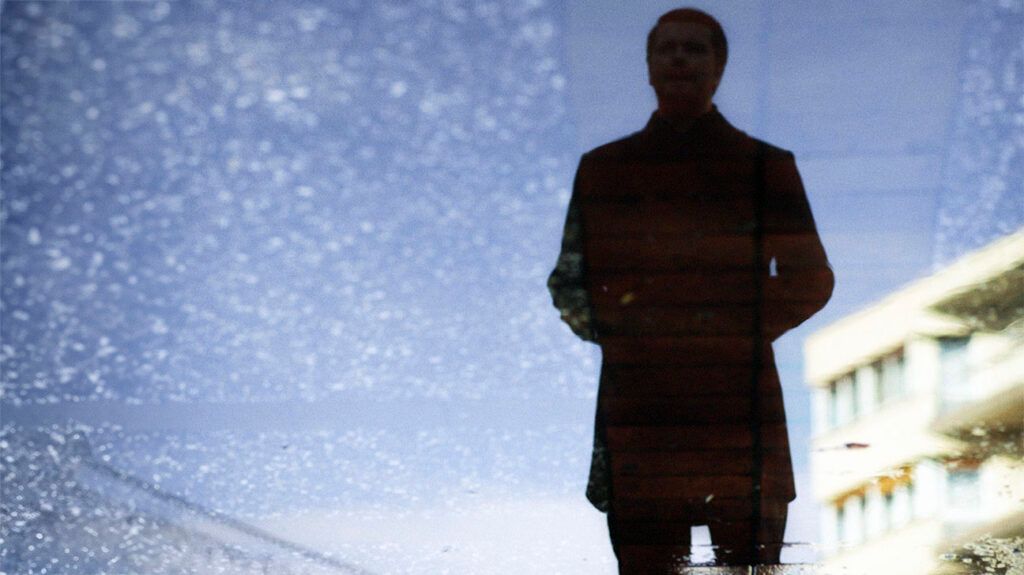 Silhouette of a male against a night sky