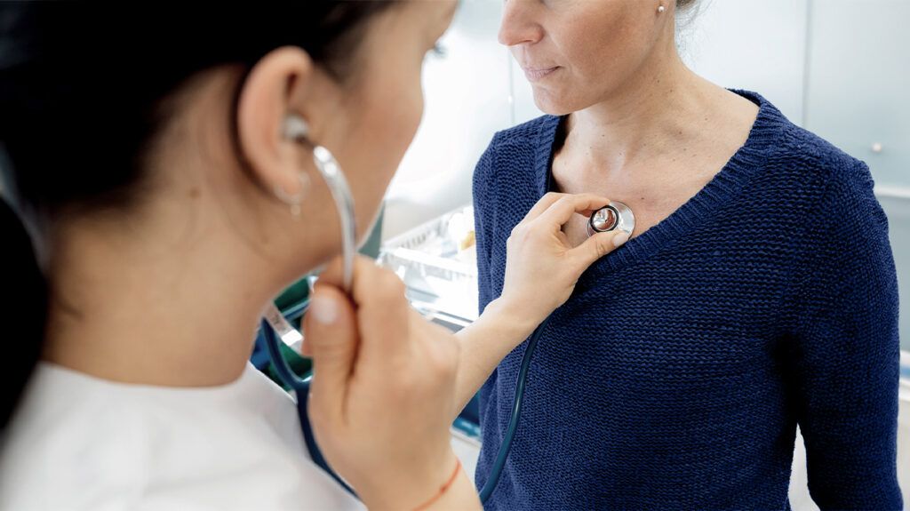 doctor listening to patient