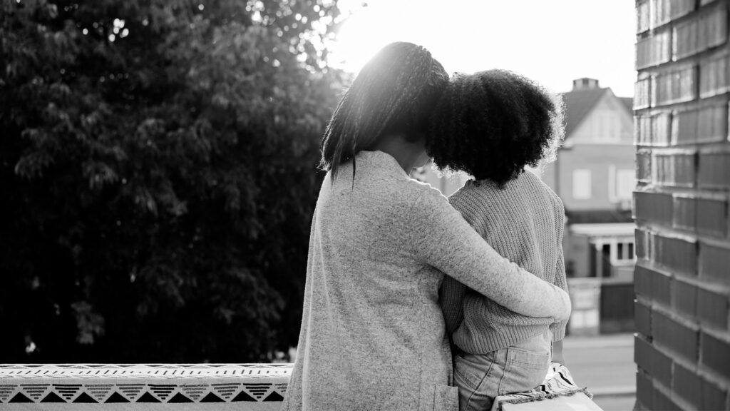 Mother and daughter hugging