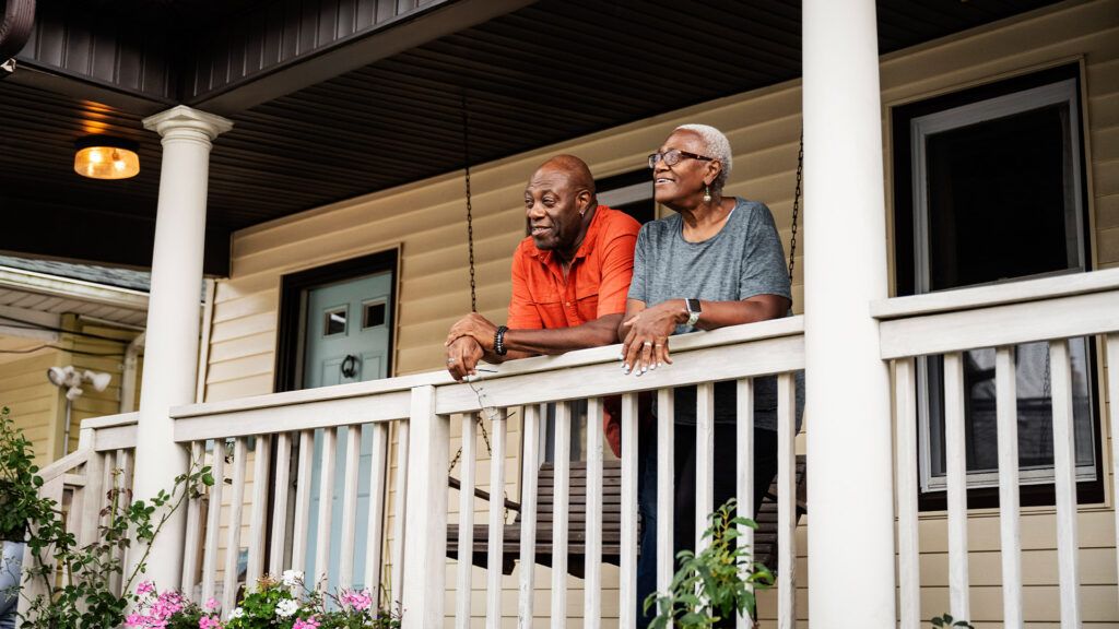 Over 65 couple standing on a porch