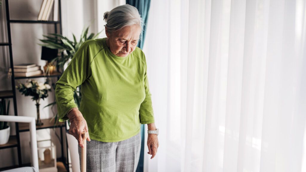 Older female walking with a cane