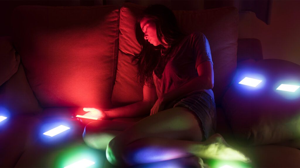 Sleeping person with colored lights