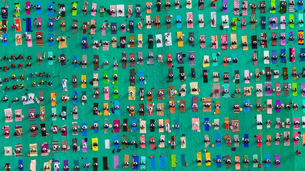 bird's-eye view of people on yoga mats