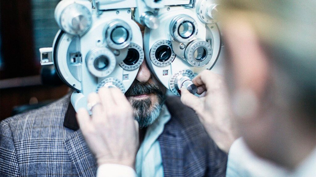 Man using eye test machine to check for glaucoma