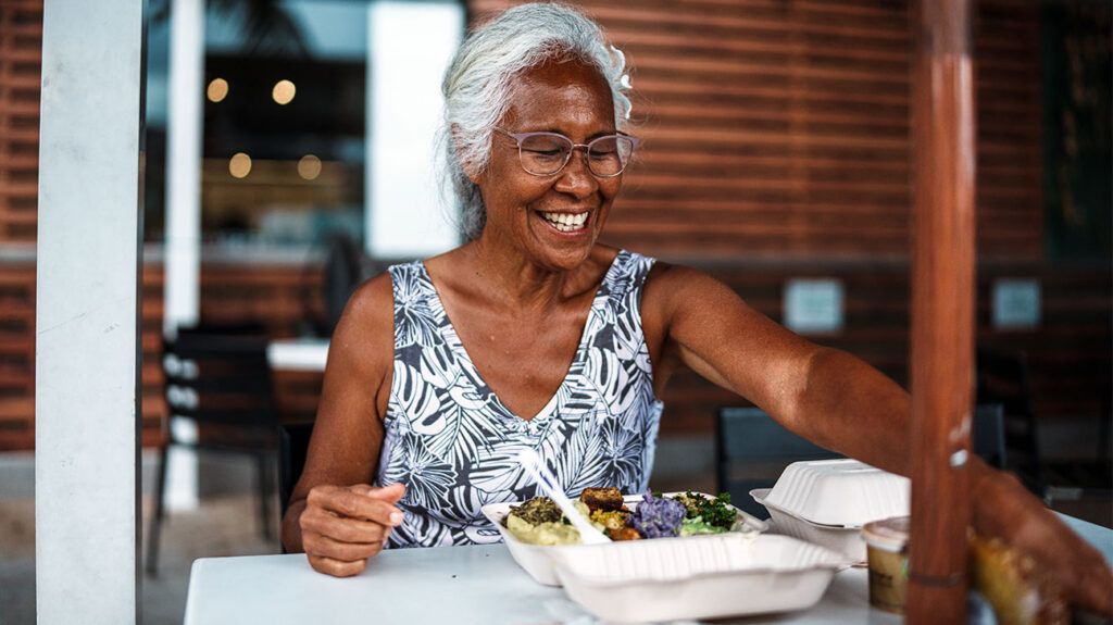 Senior woman eating at a restaurant-1