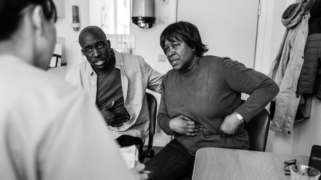 A medical professional is talking with a patient.