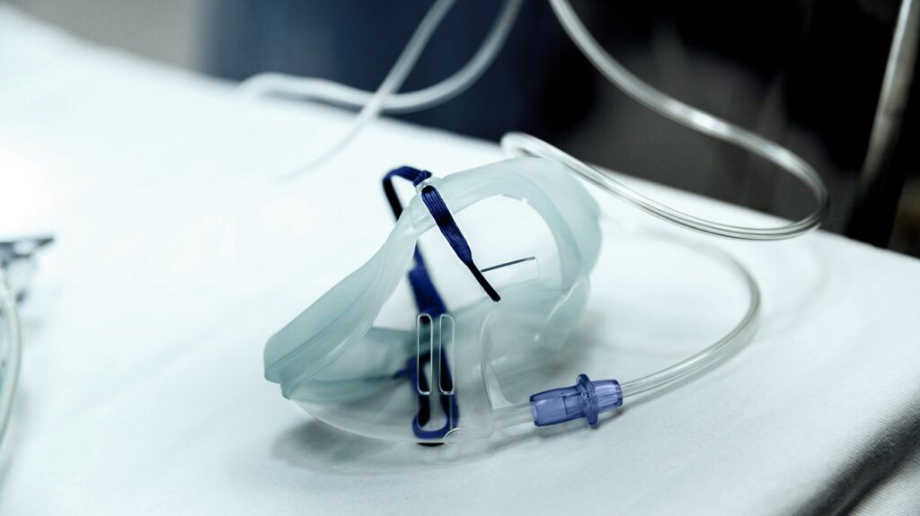 An oxygen mask on a surface at a hospital