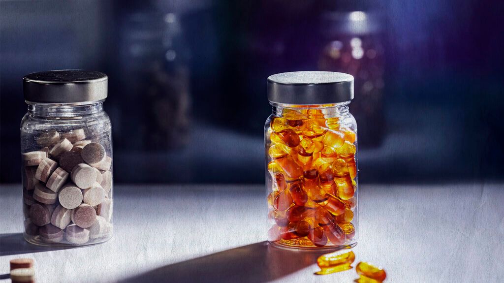 jars filled with supplement pills and capsules-1