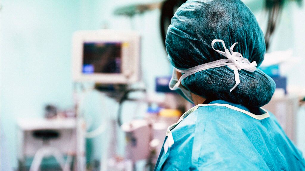 Medical professionals preparing for surgery. -2