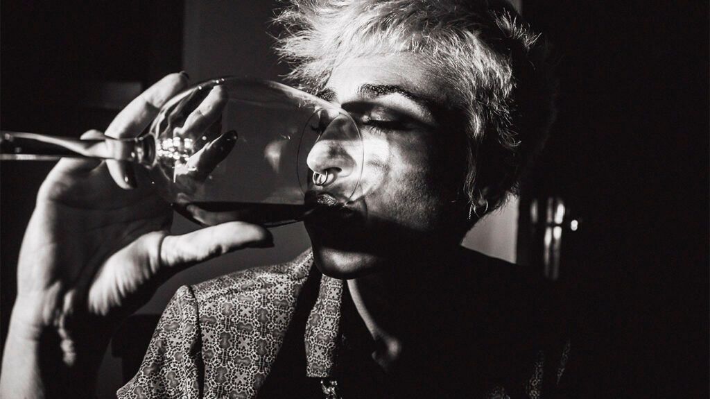 a person drinking a glass of wine-1