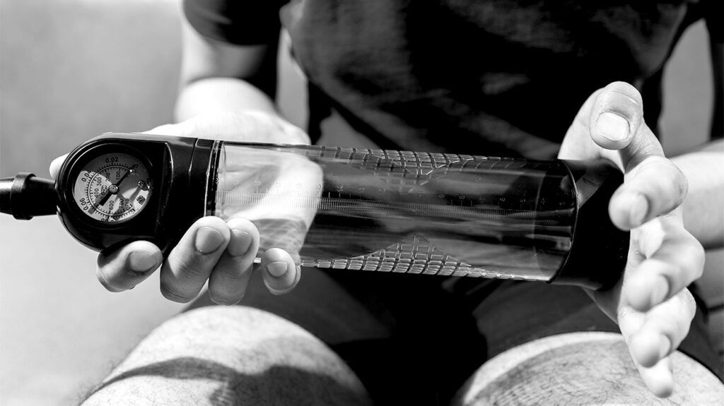 Person holding penis pump 