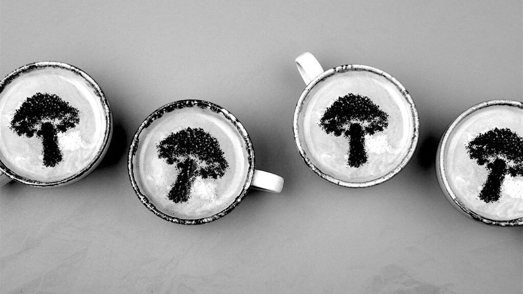 Four cups of mushroom coffee with a mushroom design in the foam. -3