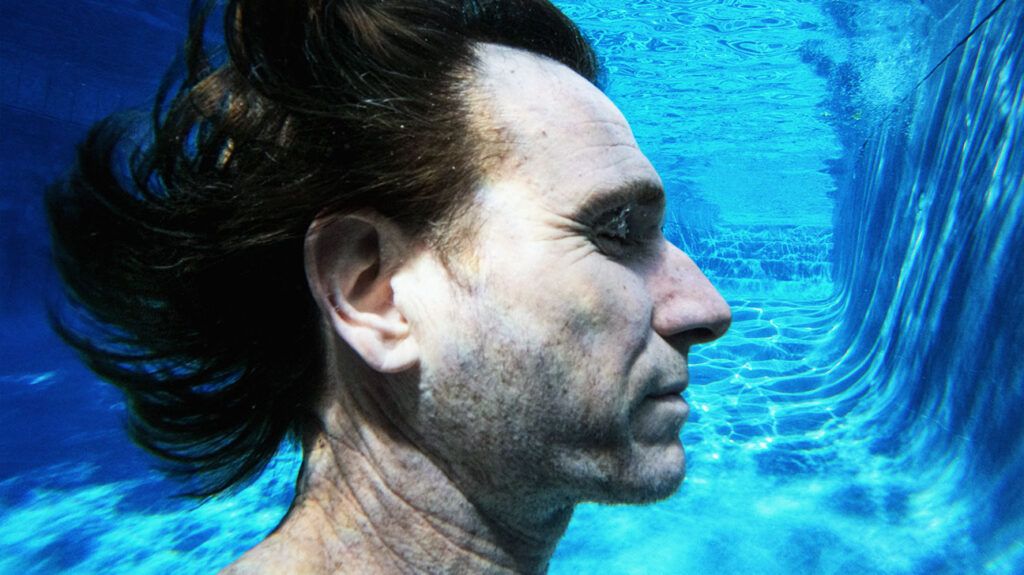 Side-on view, a man underwater