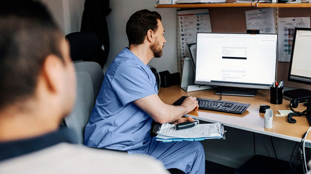 A medical professional consulting with a patient about male breast cancer. -2